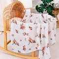 Soft muslin cotton baby blanket with blue and orange floral print in a wicker cradle - White Orange Purple Floral