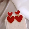 Double heart red enamel earrings with gold trim on beige velvet jewelry box - Red