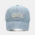 Detailed close-up of light blue washed denim baseball cap with white NERVOUS embroidery - Adjustable / Light Blue