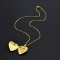 Golden heart locket necklace shown open on black background for photos and keepsakes - Leaf Pattern Heart / 50cm / Gold