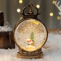 Bronze vintage Christmas lantern snow globe with tree and skier scene inside - Tree Snowman