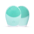 Detail view of mint green silicone facial cleanser brushes with soft bristles and power button - Green