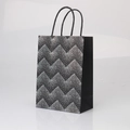 Premium black kraft gift paper bag with silver wavy zigzag pattern and rope handles - Black Card Single-Sided Silver Bronzing Quicksand Dots