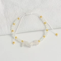 Detail of adjustable handmade bohemian bracelet with faceted white beads and clear crystals - White