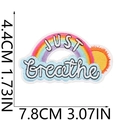 Detail view of a rainbow embroidery patch with JUST breathe text and size measurements - Rainbow Sun