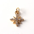 Detailed close-up of gold-plated cross star pendant set with clear cubic zirconia stones - Cross Star