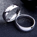 Pair of 6mm minimalist polished stainless steel couple rings on a dark textured background - US 5 / Silver