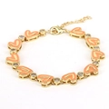 Detail of gold heart link bracelet with orange enamel charms and cubic zirconia - Orange