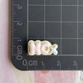 Close-up of small resin GOOD letter charm on grid mat showing 2.5 cm size detail - NO Mini Word Plate (7)