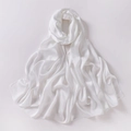 Close-up of white chiffon silk scarf showing smooth fabric texture and elegant pleats - White