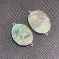Close-up of irregular ocean agate stone connector with silver metal edge and dual loops - Silver Edge