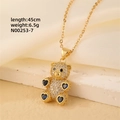 Close-up of gold teddy bear pendant with micro-pave zircons and blue heart accents - Gold - Blue Hearts Limbs Bear