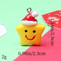 Macro shot of yellow resin star pendant with red Santa hat and dimensions shown - 14# Smile Star