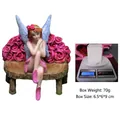 Pink fairy figurine on rose bench with packaging weight of 70g and size 6.5x6x9cm - Flower Fairy Sitting on Flower Bench