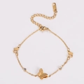 Detailed view of matte gold butterfly bracelet featuring rhinestone accents and lobster clasp - Gold