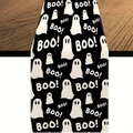 Close-up of black linen table runner featuring white ghost patterns and BOO text print - Black Background Connected Ghost BOO Pattern