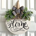 Close-up of wooden welcome wreath with greenery and bow on white front door - Bless This Home Style / White/Wood Color