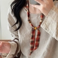 Ethnic plaid fabric necklace featuring rustic wooden beads in warm brown and beige tones - Orange