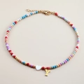 Detail of colorful beaded necklace featuring a shell heart and a golden letter Y pendant - Letter Y