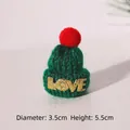 Detailed view of mini green knitted Christmas hat with LOVE text and red pompom, 5.5cm tall - Green Hat Letter Red Pom
