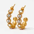 Golden C-shaped stainless steel earrings with white zircons and textured metal edges - White (KDE1228)