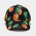 Detail of the high-quality cotton twill fabric and vibrant pineapple print on the cap - Black Pineapple Style