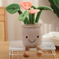 Cute pink plush potted flower doll with smiley face and dangling legs for home decor - 10cm Keychain Style / Pink