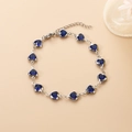 Bracelet en acier inoxydable argenté avec 12 cristaux bleus en forme de cœur - Bleu royal
