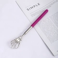 Telescopic stainless steel back scratcher with skull hand design and purple grip - Skeleton Hand Purple