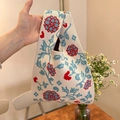 Knot handle knit handbag featuring retro floral jacquard pattern in cream and red - Hydrangea Off-white