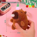 Cute brown capybara plush keychain with pink pompom and bubble nose, 11cm size - A Capybara With A Radish On Its Head Making Strange Noises And Spitting Bubbles.