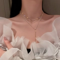 Layered butterfly choker with crystal fringe and delicate pearls on golden Y-shaped necklace - Gold Tassel