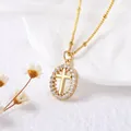 Gold oval cross pendant necklace with sparkling cubic zirconia and beaded gold chain link - Oval Cross / Gold