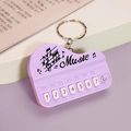 Miniature purple piano keychain toy with music notes and numbered keys design - Bag Packaging / Macaron Purple
