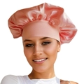Pink satin sleep bonnet for hair care with wide elastic band shown on model - Ivory