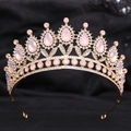 Macro shot of gold wedding tiara with pink crystals and fine white rhinestones - H1221 KC Gold + Pink Opal