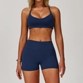 Set yoga spazzolato blu scuro con reggiseno sportivo a V e pantaloncini a vita alta - Taglia S / Top E Pantaloni / Blu Navy
