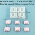 Silicone mold for DIY animal pig crafts with finished pink resin shapes on blue background - 9179-Pillow Pig