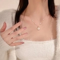 Elegant gold titanium steel necklace featuring small pearls and a camellia flower pendant - Gold - Camellia Pearl Style