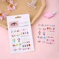 Colorful rhinestone face gems and 3D body stickers on a decorative pink background - Small Flower Colorful