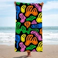 Rectangle beach towel with colorful melting smiley face pattern on black background - Black Colorful Smiley (STJ-019-011)