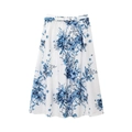 Detail of white maxi skirt featuring blue floral print and matching fabric belt tie - Skirts