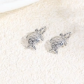 Macro shot of silver metal sea turtle charms for DIY handmade necklace and bracelet making - Sea Turtle / Silver