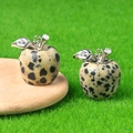 Mini apple pendant in dalmatian jasper stone with silver leaf on green moss - Spotted Stone