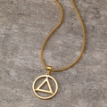 Polished gold geometric circle triangle pendant necklace on grey stone background - Gold Geometric