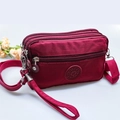 Sac bandoulière bordeaux à fermetures éclair multiples et logo sport étoile - Bordeaux