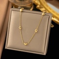 Elegant gold necklace featuring five 3D heart charms on a delicate polished chain - Eight Hearts Necklace / Gold