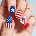 Close-up of patriotic American flag press-on nails with red stripes and blue stars - Glossy Long Round Stars Stripes Style (CW551) / Yellow Jelly Glue + Nail File