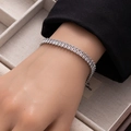Close-up of rectangular clear zircon tennis bracelet on wrist with elegant silver finish - Silver Medium Rectangle