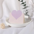 Pink and purple heart greeting card with Best Wishes text on a white tray - Creamy Purple